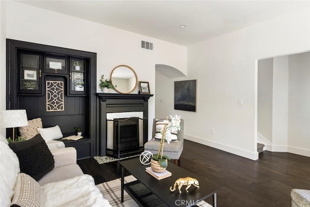 living room featuring dark wood-type flooring