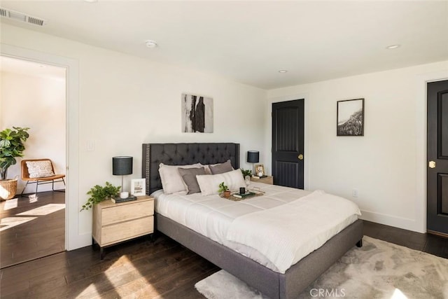 bedroom featuring dark hardwood / wood-style flooring