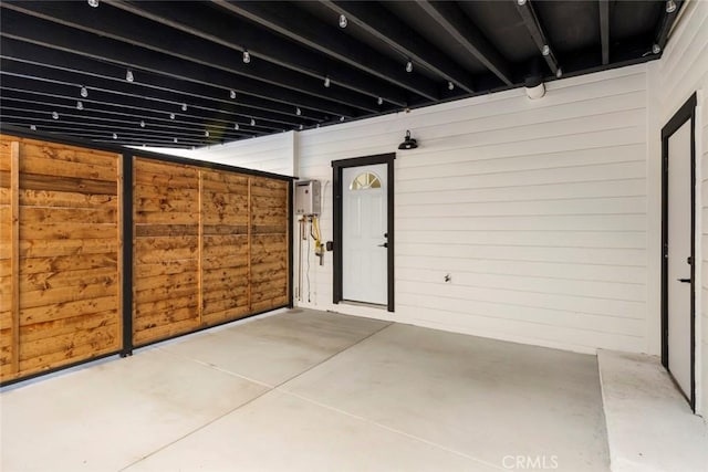 garage featuring wooden walls