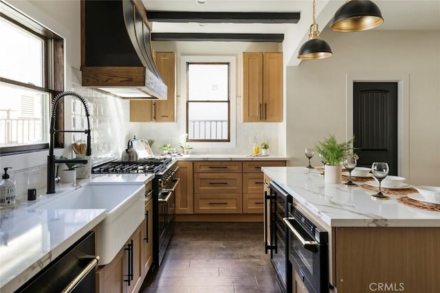 kitchen with stainless steel stove, decorative light fixtures, dishwasher, custom exhaust hood, and light stone countertops