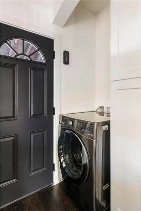 washroom featuring washer / clothes dryer and dark wood-type flooring