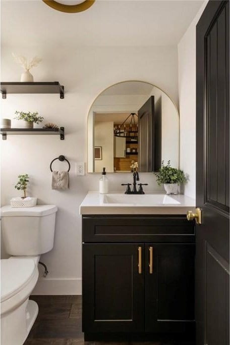 bathroom featuring vanity, hardwood / wood-style floors, and toilet