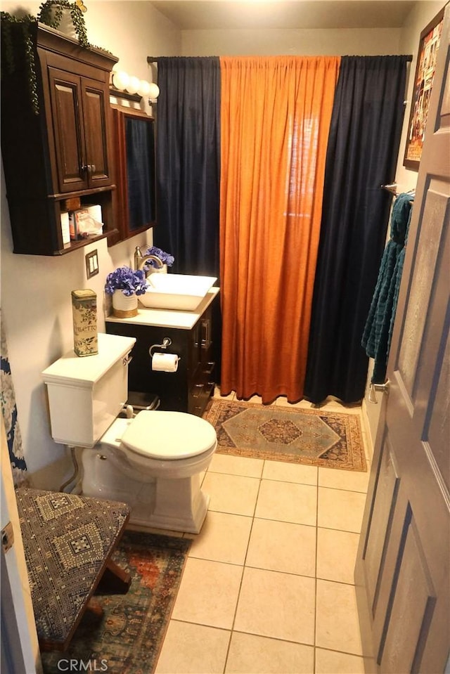 bathroom with sink, tile patterned floors, and toilet