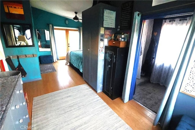 bedroom featuring light hardwood / wood-style flooring and french doors