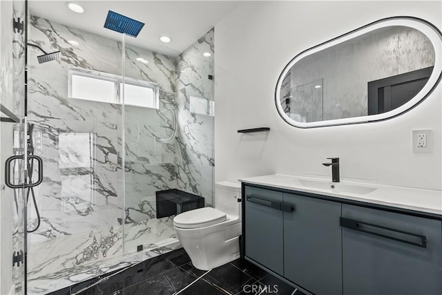 bathroom featuring vanity, an enclosed shower, and toilet