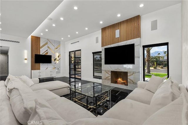 living room featuring a premium fireplace