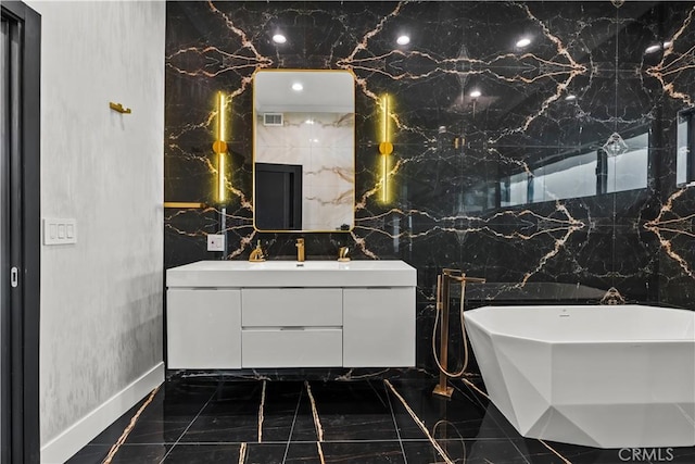 bathroom featuring a bathing tub and vanity