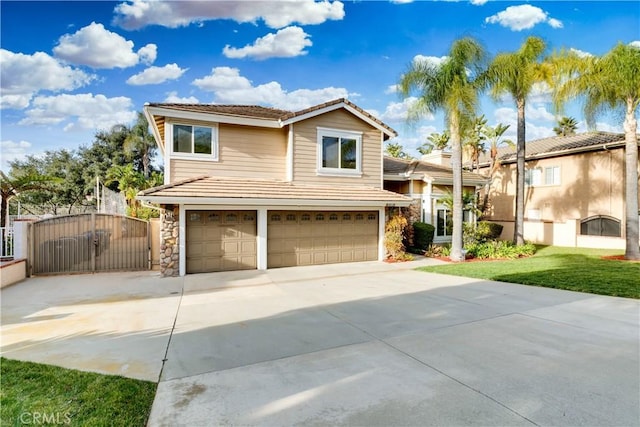 view of front of home with a garage and a front lawn