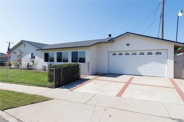 single story home with a garage and a front lawn