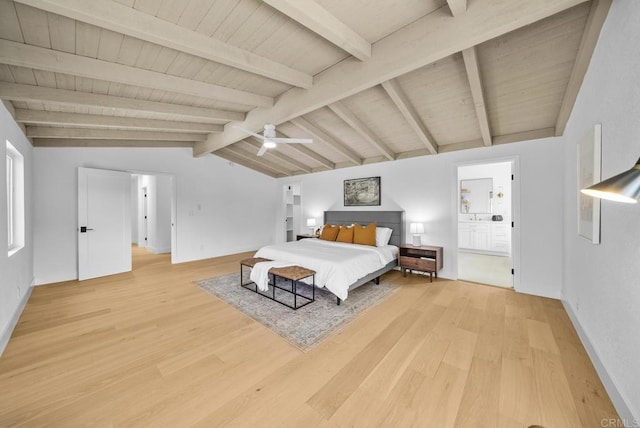 bedroom with ceiling fan, vaulted ceiling with beams, light wood-type flooring, and ensuite bath