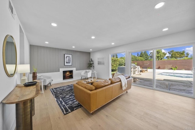 living room with light hardwood / wood-style floors