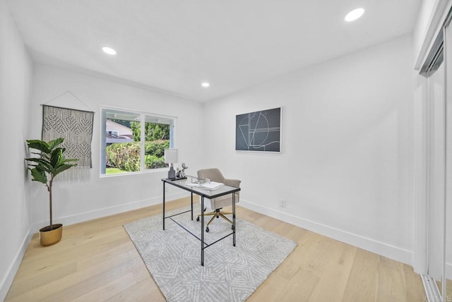 home office featuring light hardwood / wood-style floors