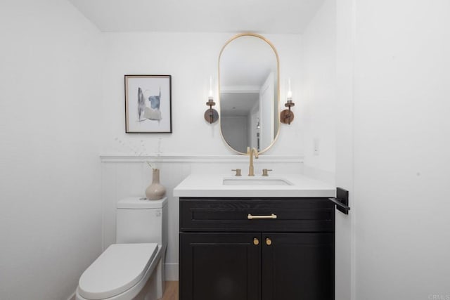 bathroom with vanity and toilet