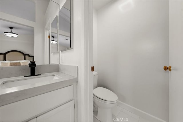 bathroom with vanity and toilet