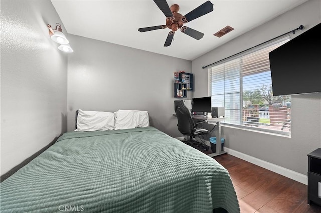 bedroom featuring dark wood-type flooring and ceiling fan