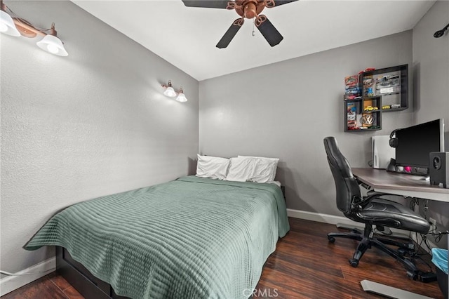 bedroom featuring dark hardwood / wood-style floors and ceiling fan