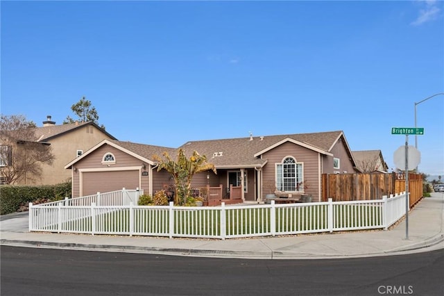 ranch-style house featuring a garage and a front lawn