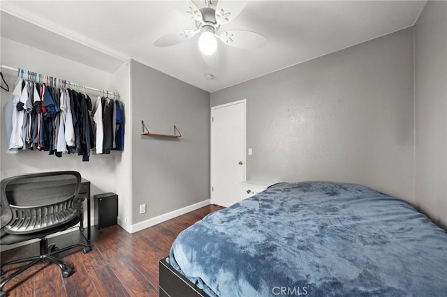 bedroom with dark wood-type flooring and ceiling fan