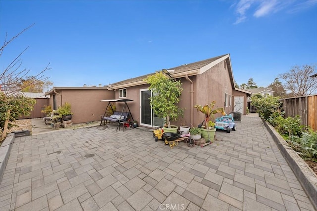 rear view of property featuring a patio