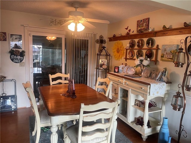 dining area featuring ceiling fan, a textured ceiling, and dark hardwood / wood-style flooring