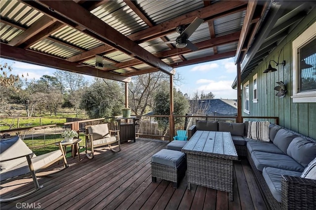 wooden terrace featuring ceiling fan and outdoor lounge area