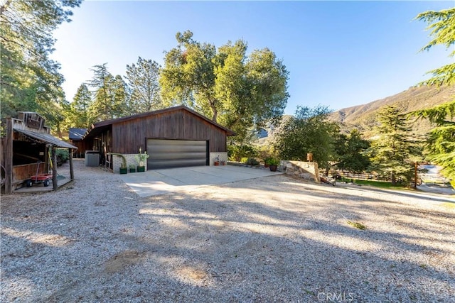 garage featuring cooling unit and a mountain view