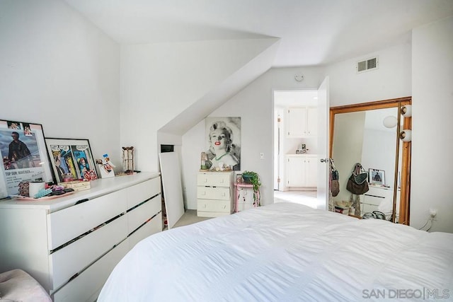 carpeted bedroom featuring lofted ceiling