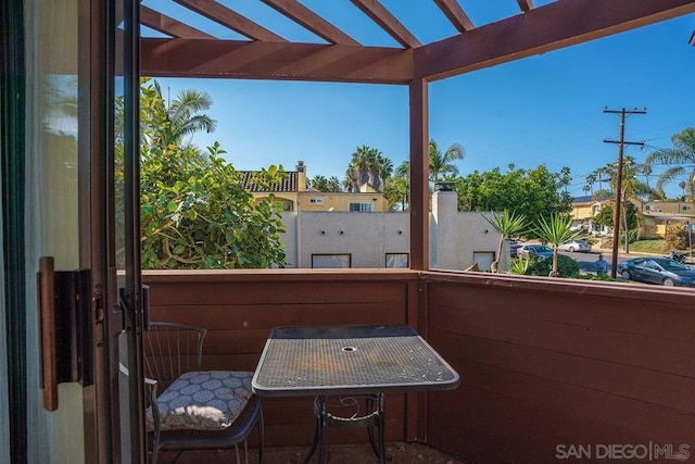 balcony featuring a pergola