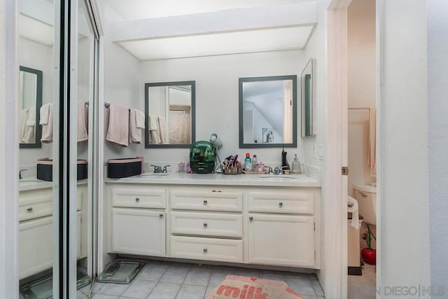 bathroom with vanity and tile patterned floors