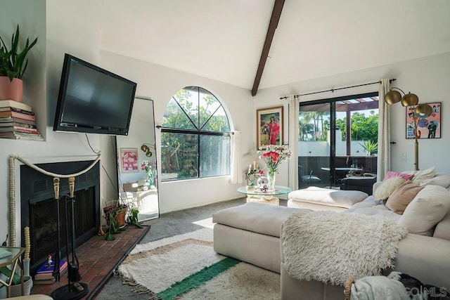 carpeted living room featuring lofted ceiling with beams and a brick fireplace