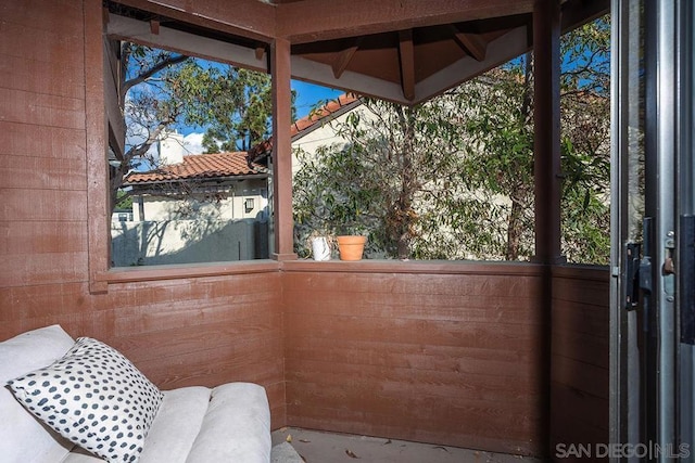 unfurnished sunroom with plenty of natural light