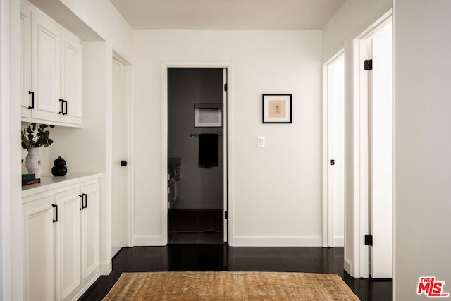 hallway featuring dark hardwood / wood-style flooring