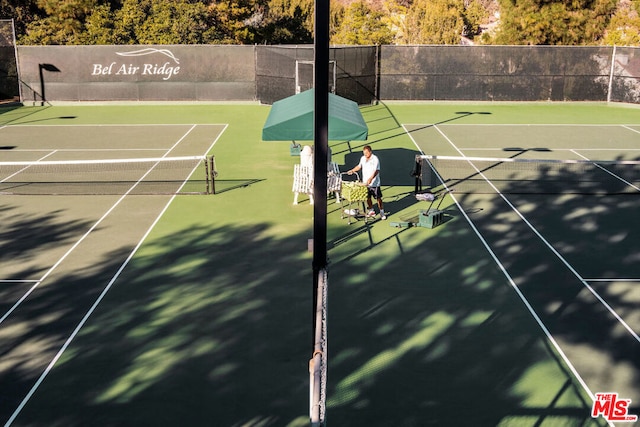 view of tennis court with basketball court