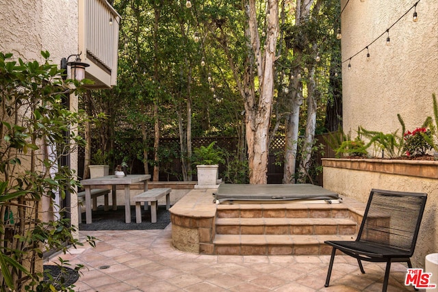 view of patio / terrace featuring a jacuzzi