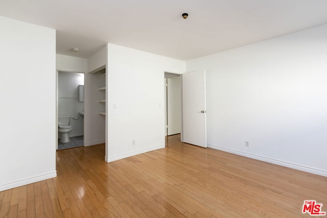 unfurnished bedroom with light hardwood / wood-style floors