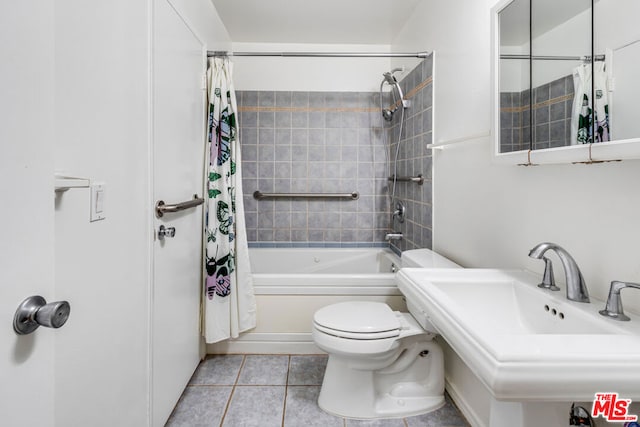 full bathroom featuring tile patterned flooring, sink, shower / bathtub combination with curtain, and toilet