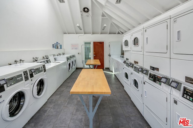 laundry room featuring stacked washing maching and dryer and washer and clothes dryer