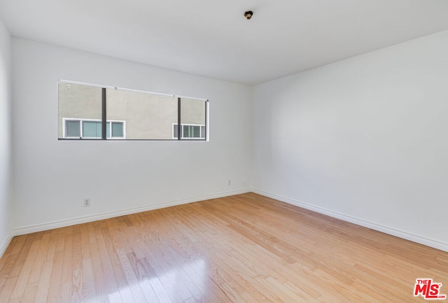 empty room featuring hardwood / wood-style floors