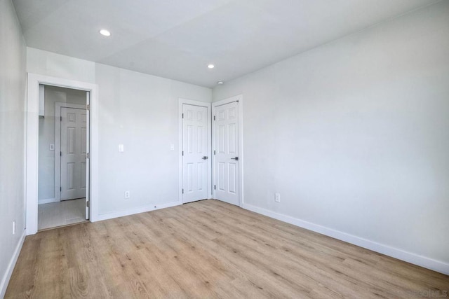 spare room with light hardwood / wood-style floors