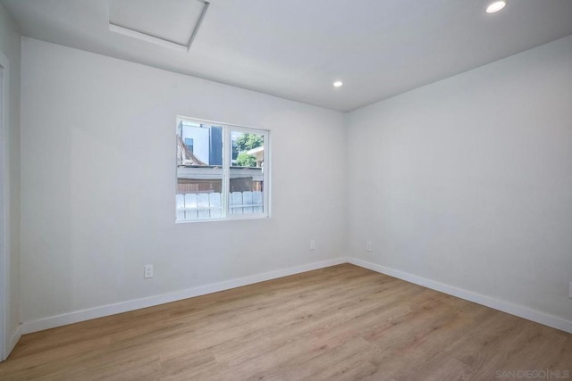 empty room with light hardwood / wood-style floors