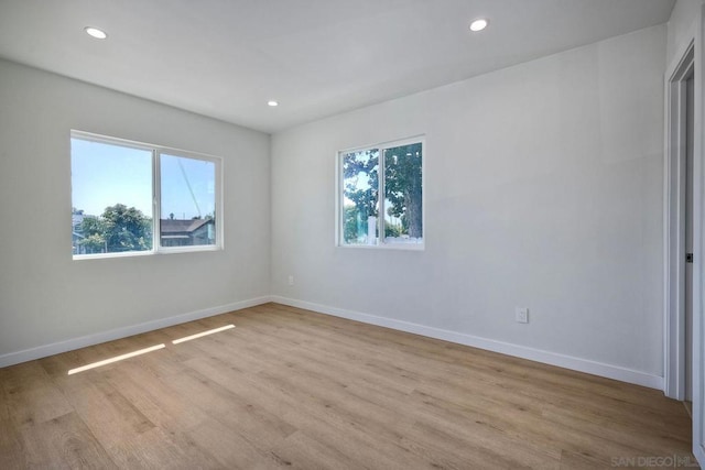 spare room featuring light wood-type flooring