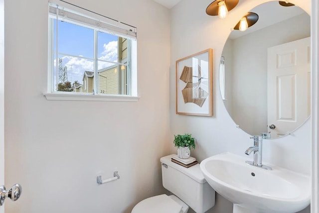 bathroom featuring toilet and sink