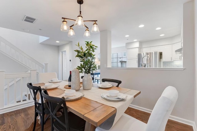 dining room featuring dark hardwood / wood-style flooring