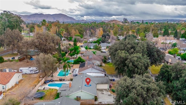 birds eye view of property featuring a mountain view