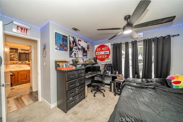 bedroom with light colored carpet and ceiling fan