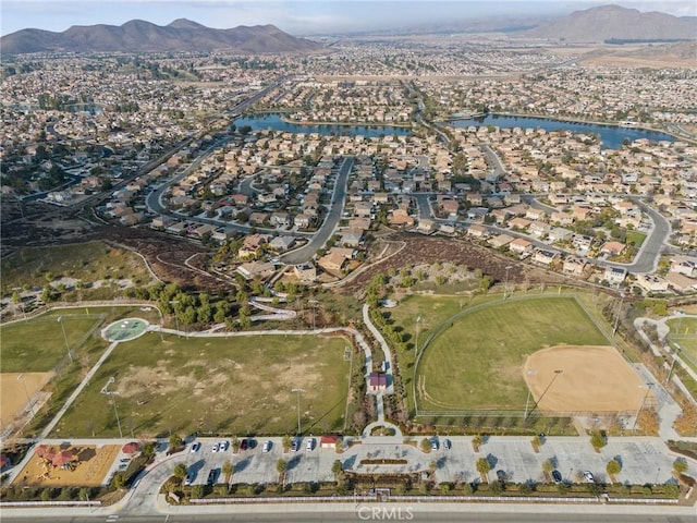 drone / aerial view with a water and mountain view