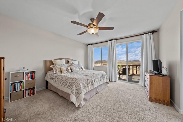 bedroom featuring ceiling fan, light colored carpet, and access to exterior