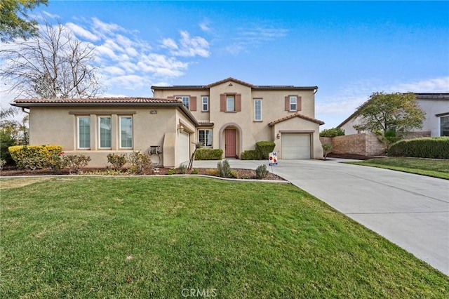 mediterranean / spanish house featuring a garage and a front lawn