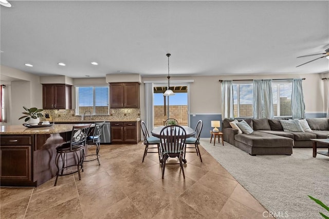 dining room featuring ceiling fan