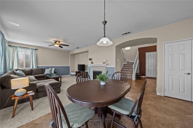 dining space featuring ceiling fan